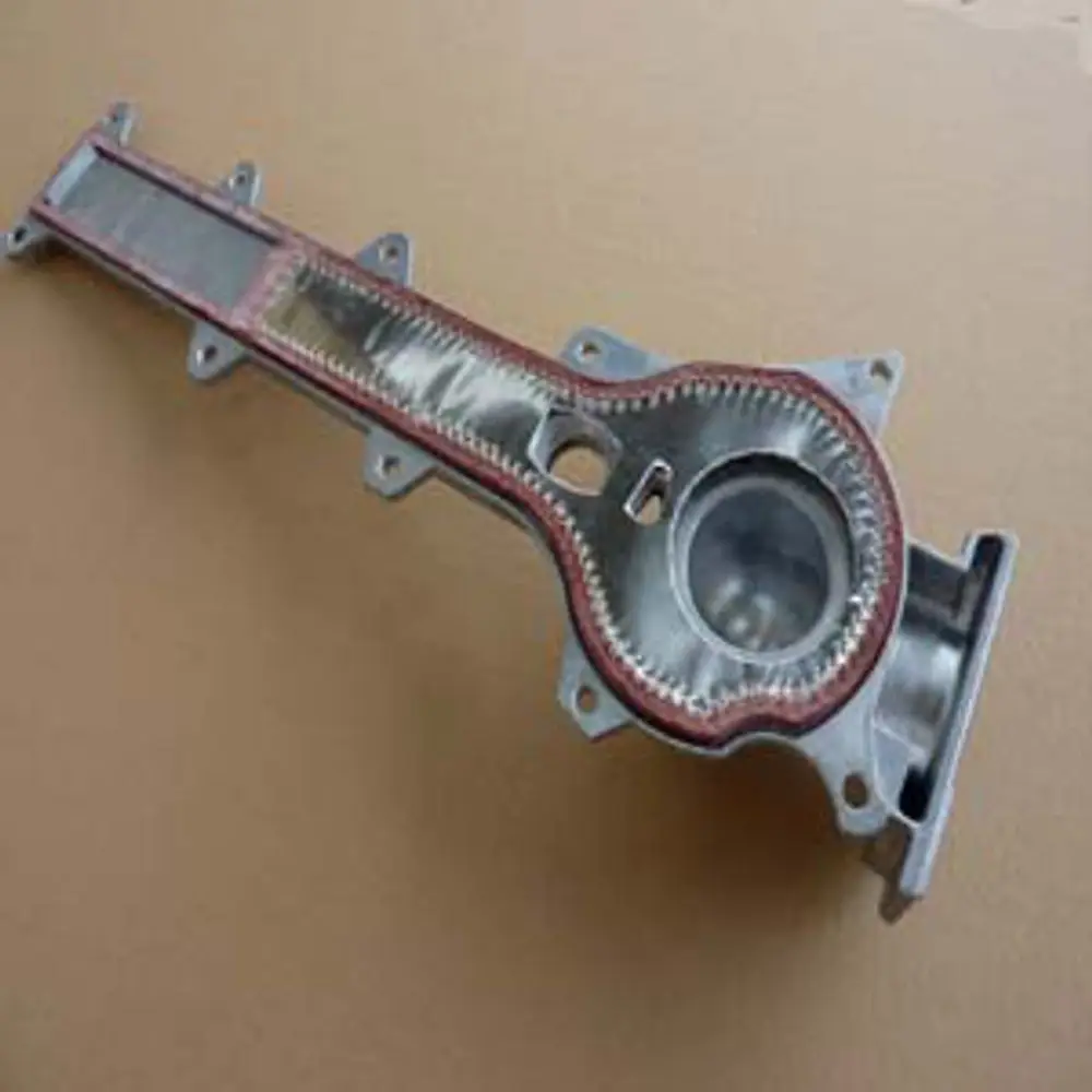 Remeha-Komponente, metallischer Inspektionsdeckel mit Gewinde und mehreren Befestigungslöchern, auf einer neutralen Unterlage abgebildet.